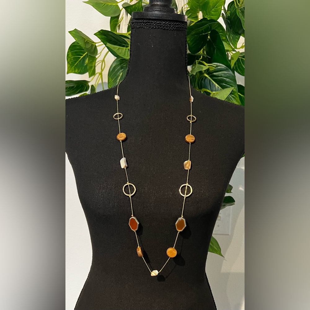 Gold tone necklace with wood and pearlescent stones